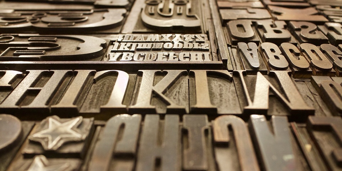 Close-up of metal and wood letterpress type blocks