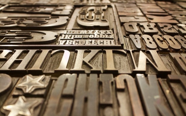 Close-up of metal and wood letterpress type blocks