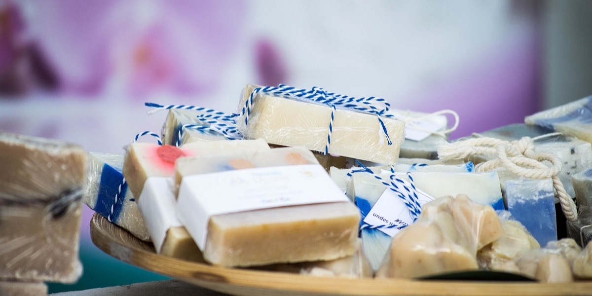 Handmade soap bars wrapped in simple labels and twine, a small-business brand