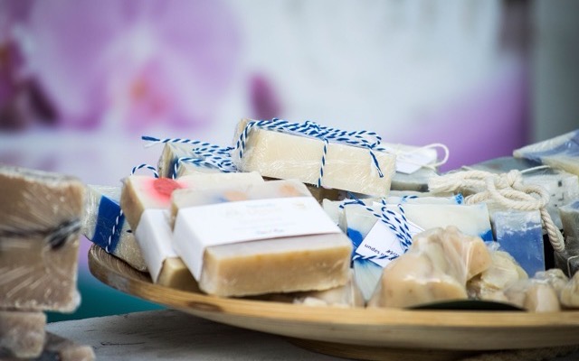 Handmade soap bars wrapped in simple labels and twine, a small-business brand